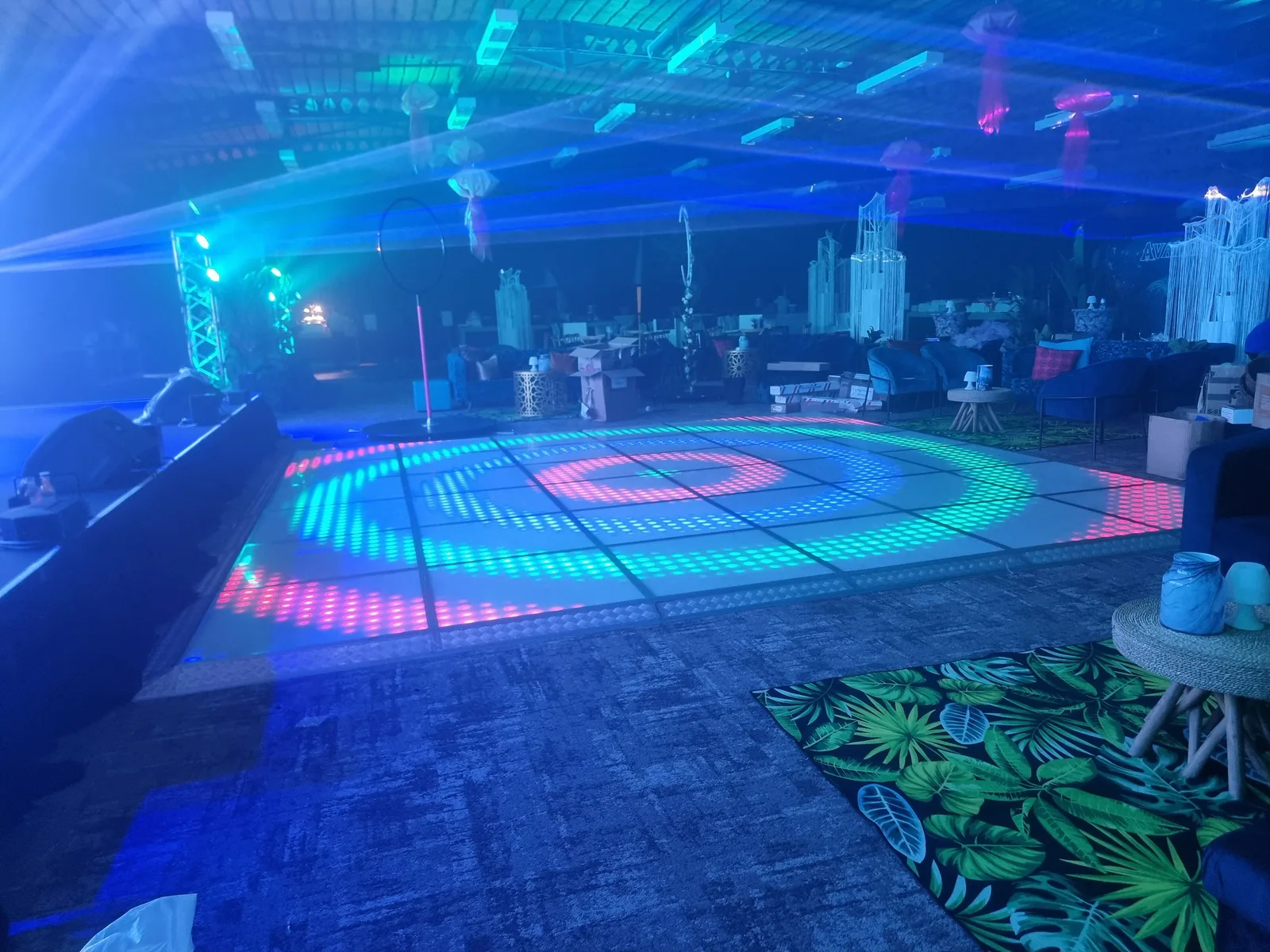 Large LED dance floor glowing blue and pink