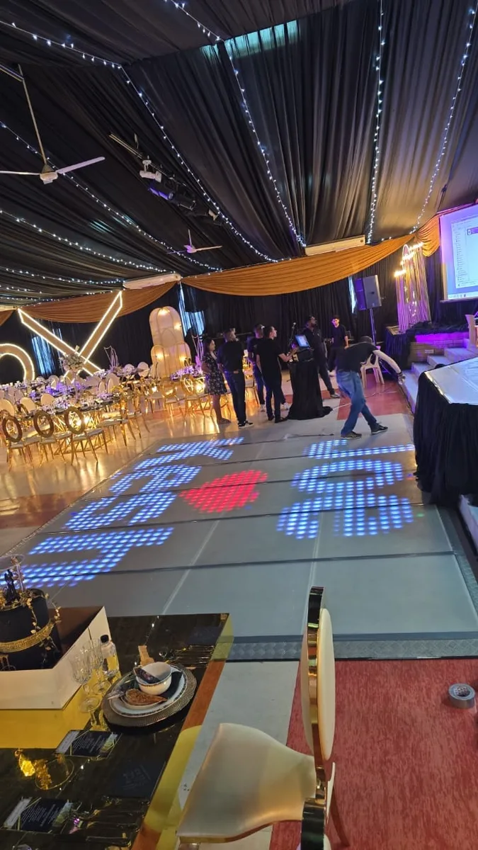 LED dance floor showing heart graphics at a formal event